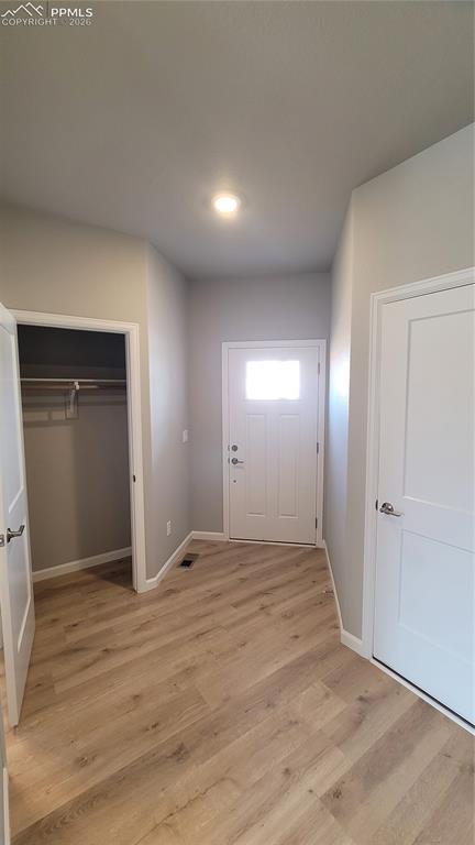 Image 3 of 36: Entry with coat closet, LVP Flooring, and Garage Entry!