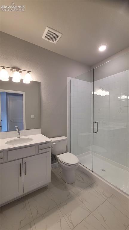 Image 33 of 36: 3/4 Bathroom with quartz countertop and tile surrounds, located in the base