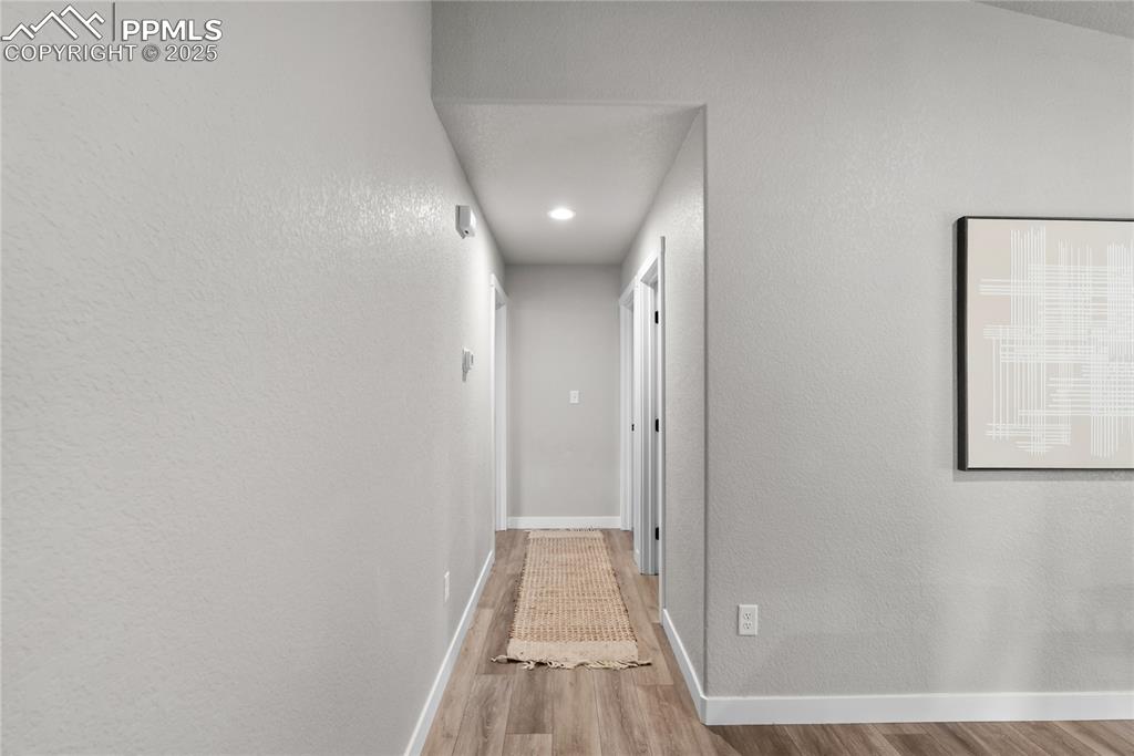 Image 12 of 31: hallway towards bedroom and primary room
