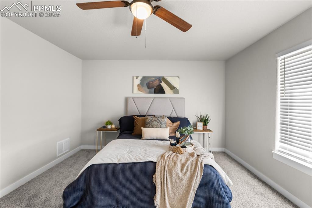 Image 15 of 31: master bedroom staged with Queen size bed