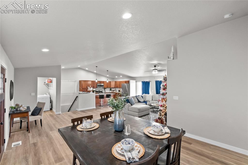 Image 6 of 31: dining, living room and laundry room 