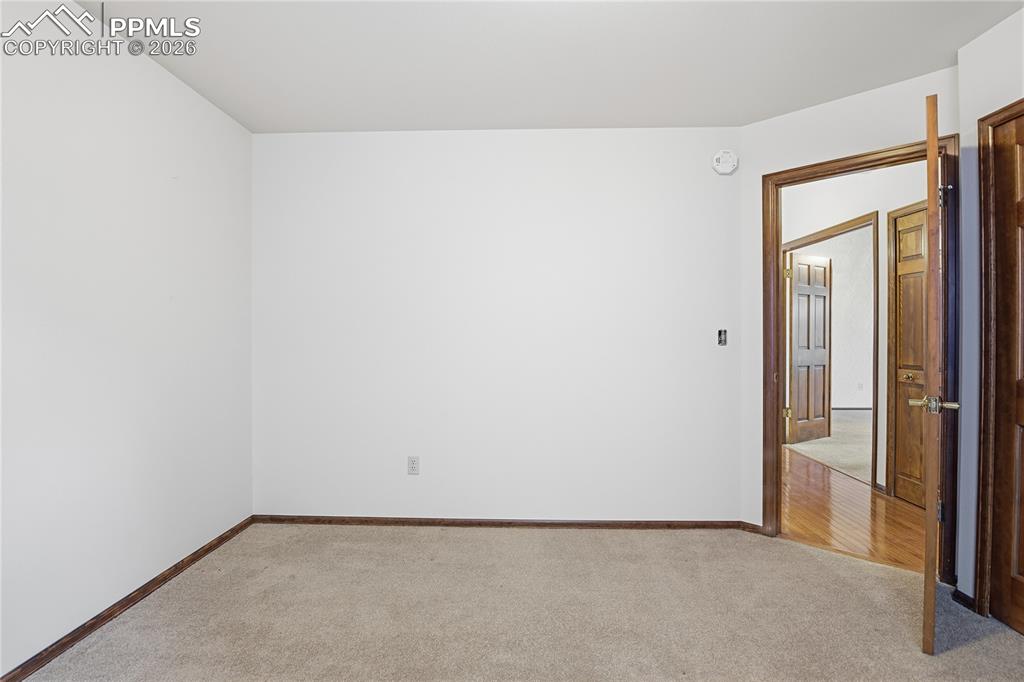 Image 28 of 47: Spare room with carpet floors and baseboards