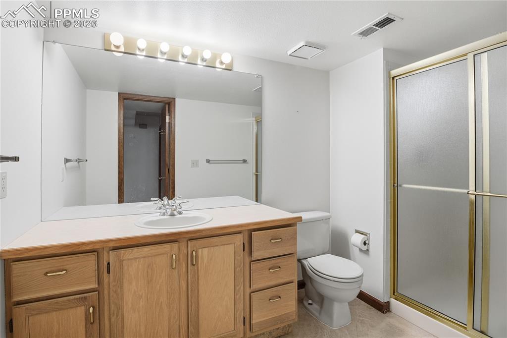 Image 41 of 47: Bathroom featuring vanity and a shower stall