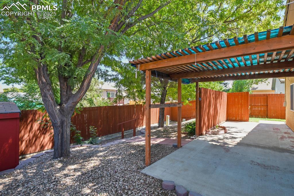 Image 26 of 29: View of yard featuring a pergola and a patio area