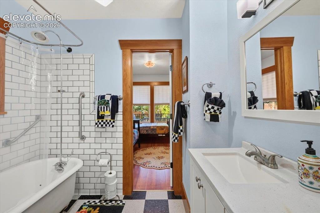 Image 10 of 50: Updated Bathroom – Beautifully remodeled bathroom featuring subway tile sur