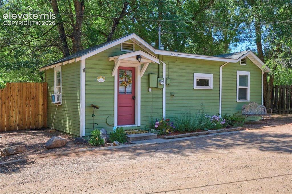 Image 13 of 50: Sunflower Cottage Exterior – Charming standalone cottage with attractive la