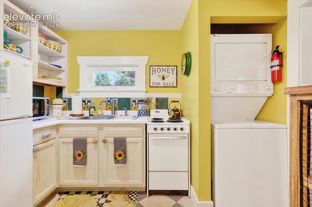 Image 15 of 50: Sunflower Cottage Kitchen & Laundry – Efficient kitchen complete with appli