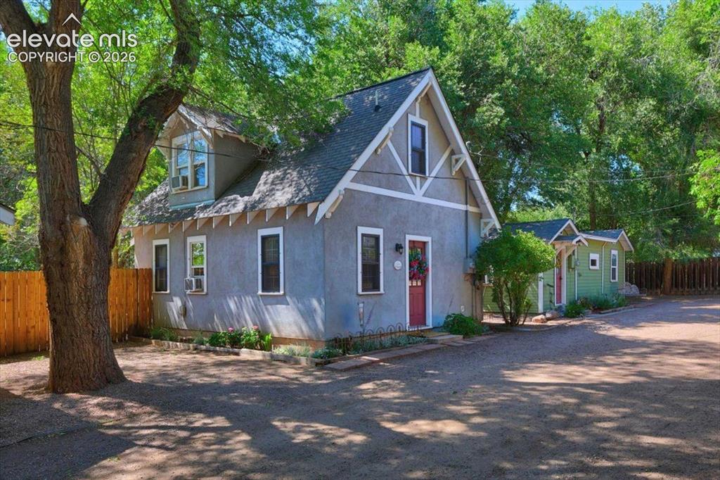 Image 19 of 50: Monet Cottage – View of the charming cottage collection nestled beneath mat