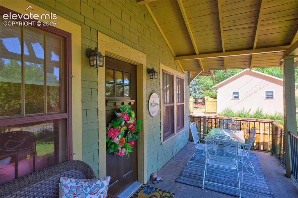 Image 2 of 50: Covered Front Porch – Spacious front porch offering comfortable outdoor sea