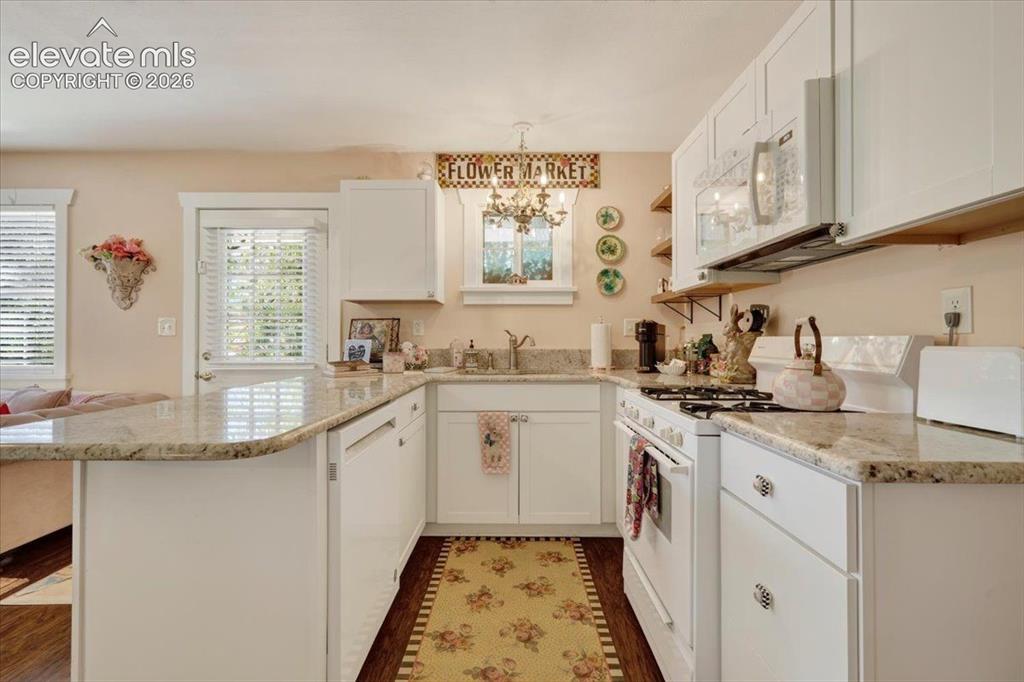 Image 22 of 50: Monet Cottage Updated Kitchen – Beautifully updated kitchen featuring grani