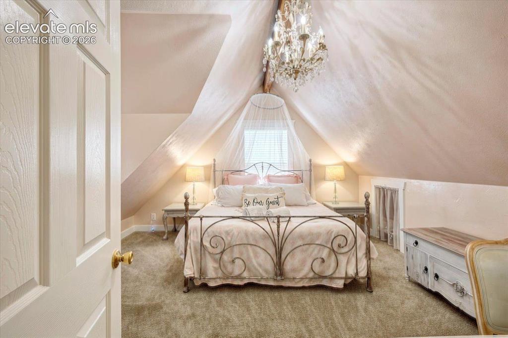 Image 23 of 50: Monet Cottage Upper-Level Bedroom Suite – Spacious upstairs bedroom with va