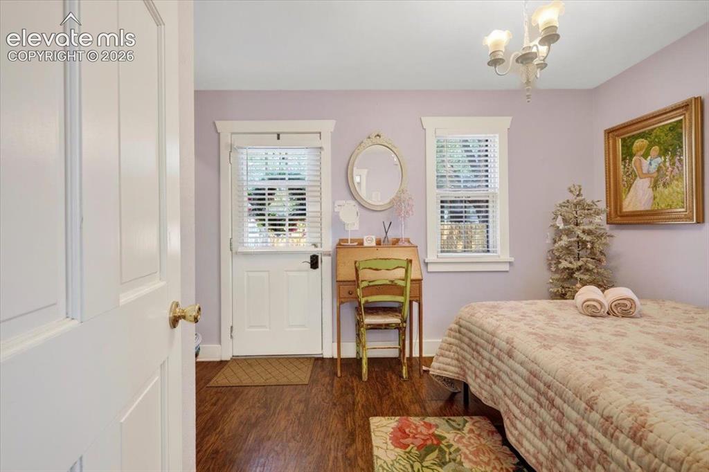Image 25 of 50: Monet Cottage Guest Bedroom – Bright and comfortable bedroom offering flexi