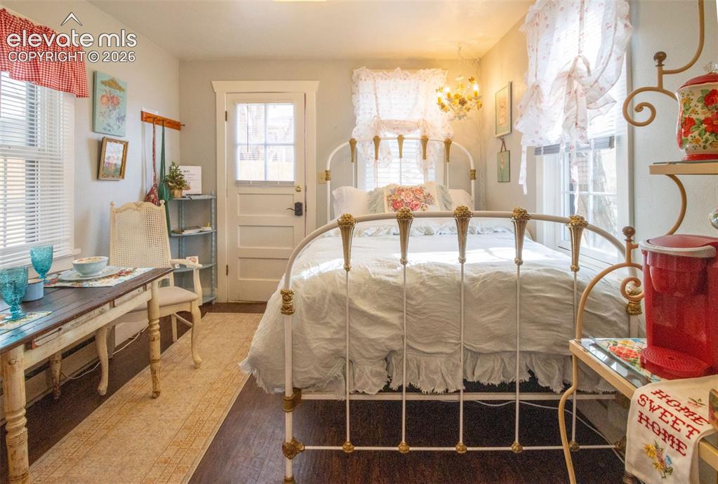 Image 29 of 50: Sweet Rose Cottage Bedroom – Inviting bedroom featuring vintage charm, abun
