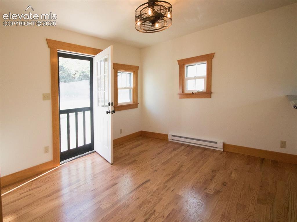 Image 36 of 50: Cottage #1 Living Area – Inviting living space featuring hardwood flooring,