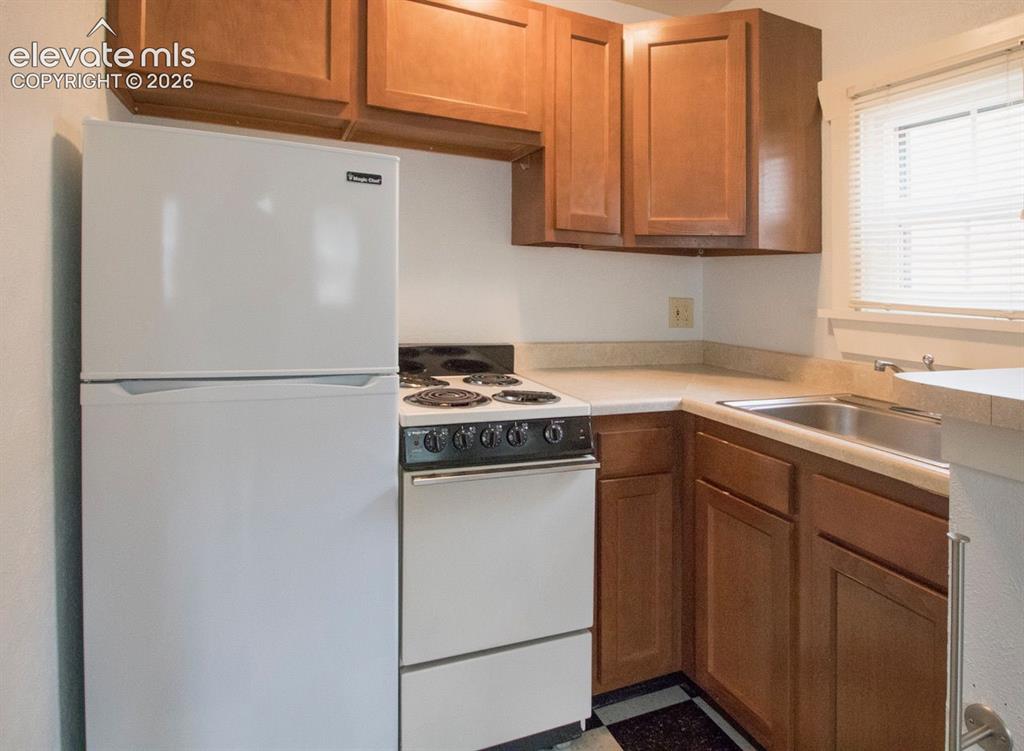 Image 42 of 50: Private Cottage #2 Kitchen – Efficient kitchenette featuring ample cabinetr