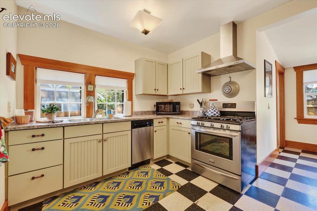 Image 6 of 50: Updated Kitchen – Tastefully updated kitchen with stainless steel appliance