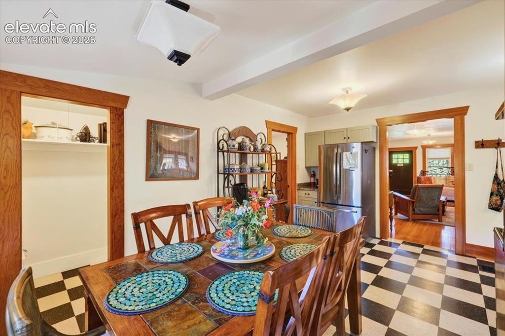 Image 7 of 50: Dining room adjacent to the kitchen with ample space for entertaining and c