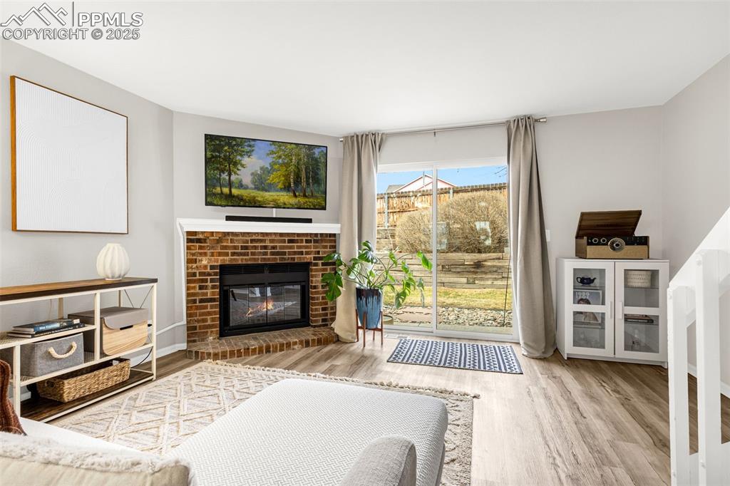 Image 8 of 30: Open concept living room with fireplace