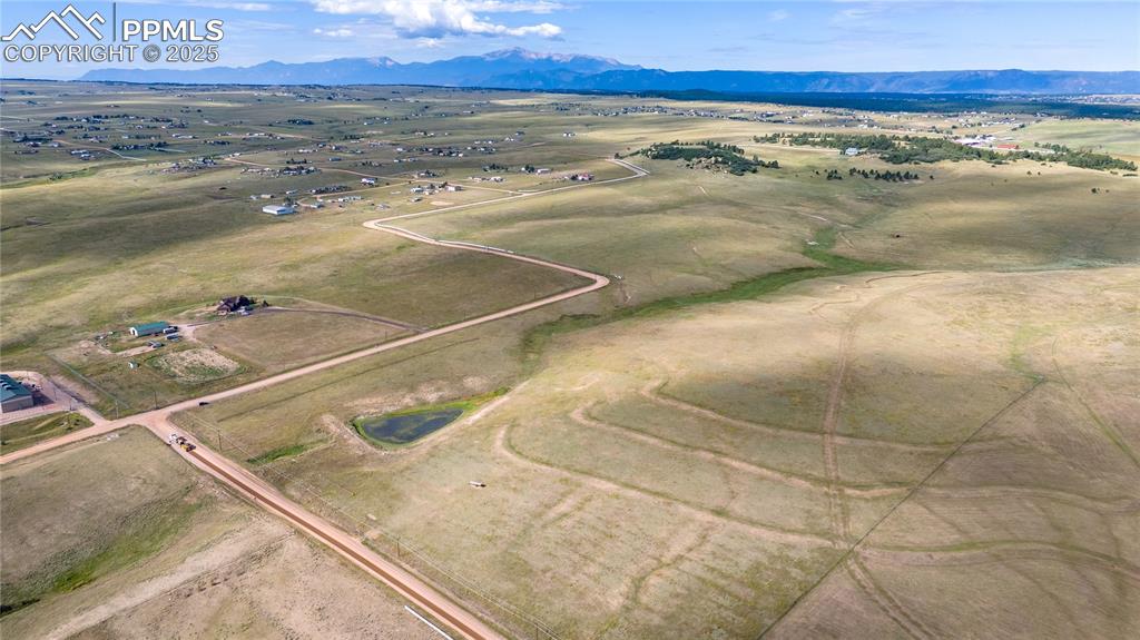 Image 2 of 12: Aerial view featuring a rural view and a mountain view