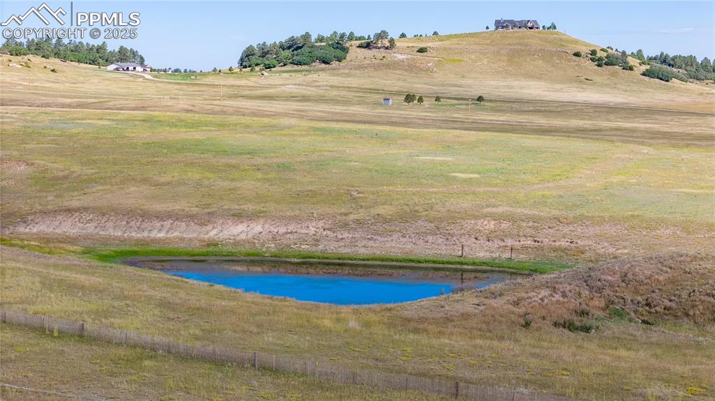 Image 3 of 12: View of swimming pool with a rural view