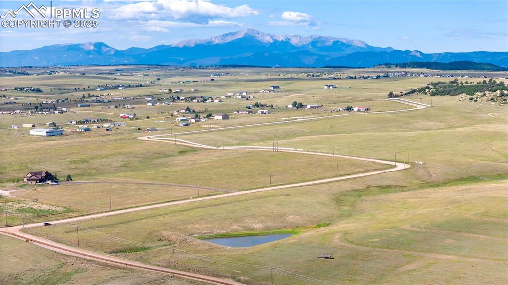 Image 5 of 12: Birds eye view of property featuring a mountain view and a rural view