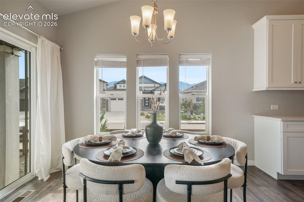 Image 12 of 49: Dining area featuring sliding glass door