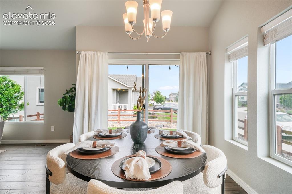 Image 13 of 49: Dining area featuring LVP