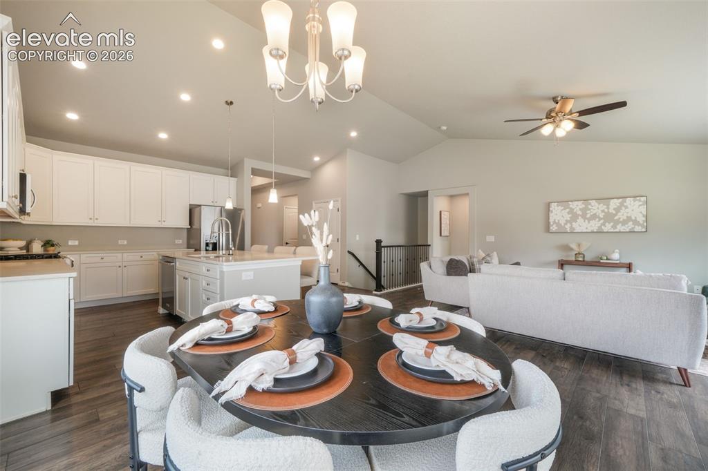 Image 16 of 49: Open-concept living area with LVP