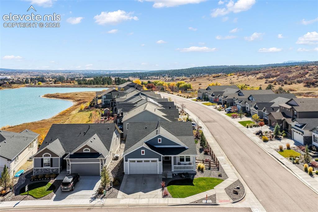 Image 3 of 49: Contemporary residential community featuring a lakefront setting and expans