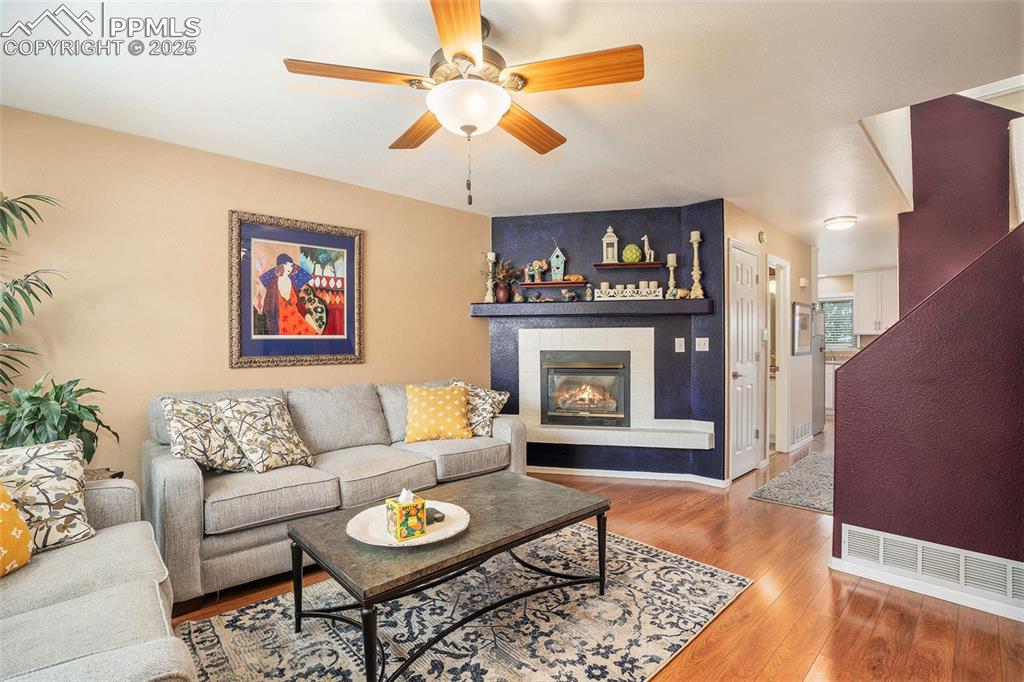 Image 3 of 23: View of living room upon entry into home featuring relatively new floors, a