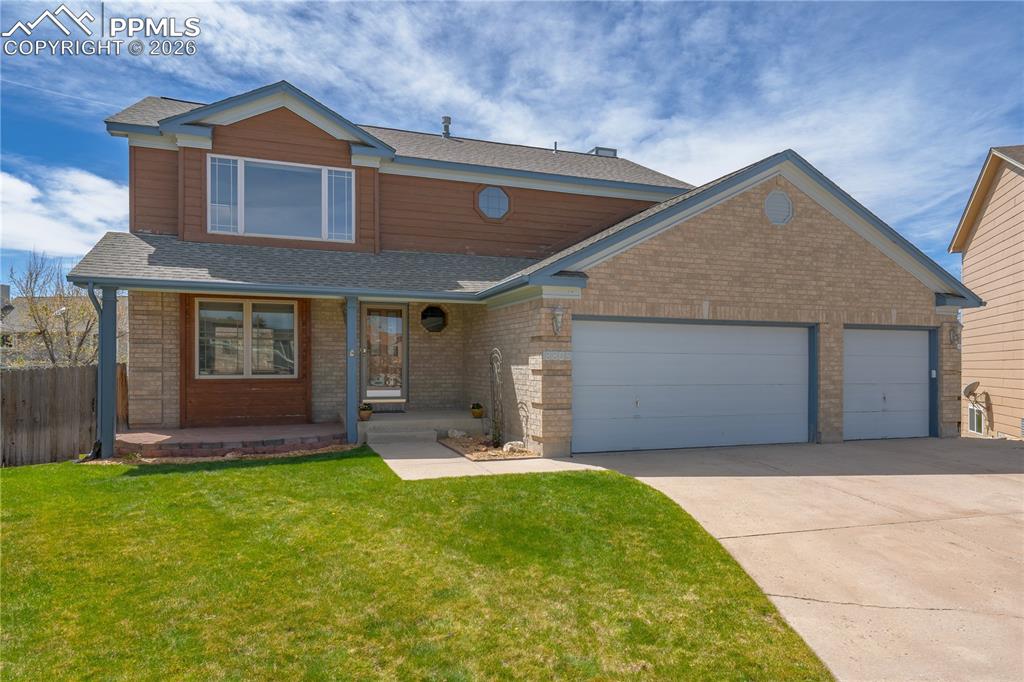 Caption: The property features a two-story design with a brick and wood-paneled exterior, a covered front por
