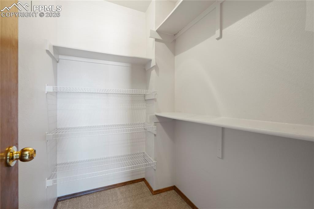 Image 18 of 46: Primary Closet