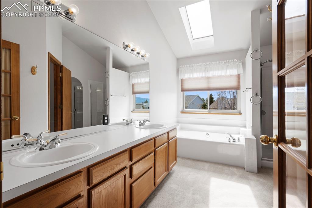 Image 20 of 46: Primary Bathroom featuring a double vanity with ample counter space, a larg