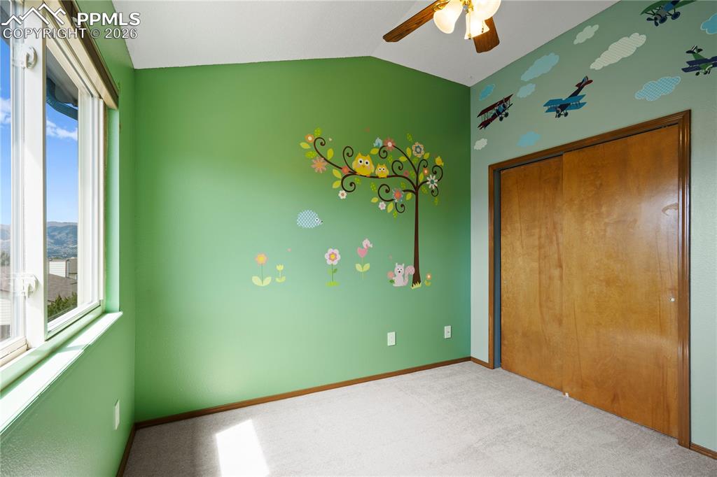 Image 26 of 46: Bedroom/Nursery a window providing natural light and scenic views
