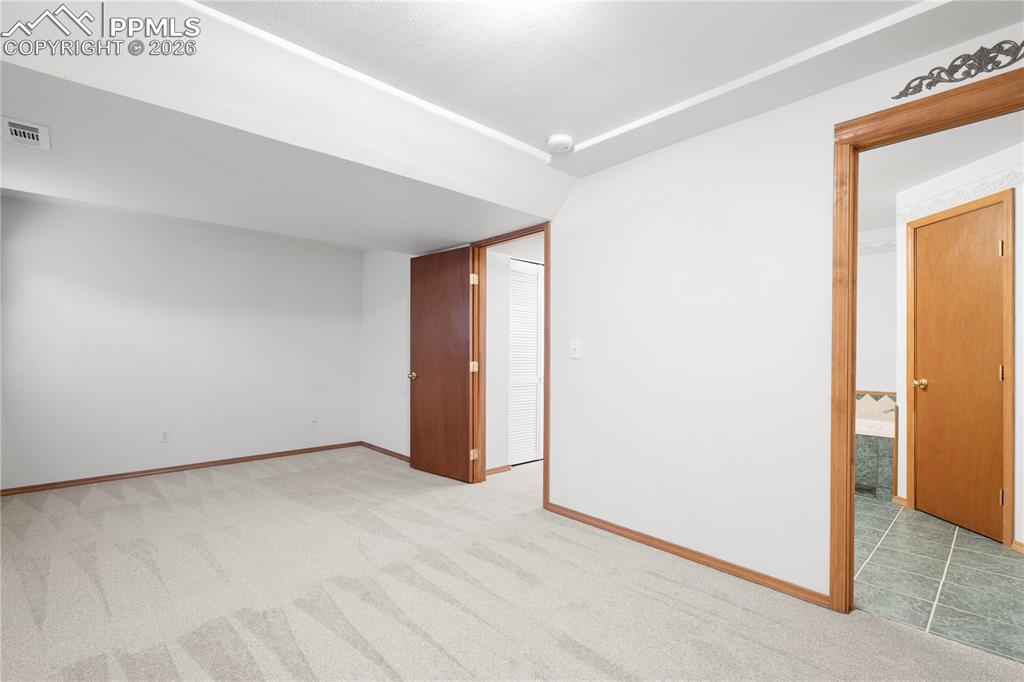 Image 32 of 46: Basement secondary suite features brand new carpeting