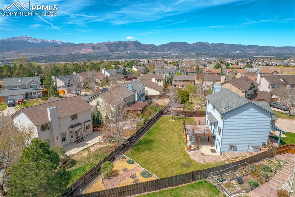 Image 45 of 46: This property features an expansive backyard with a well-maintained lawn an