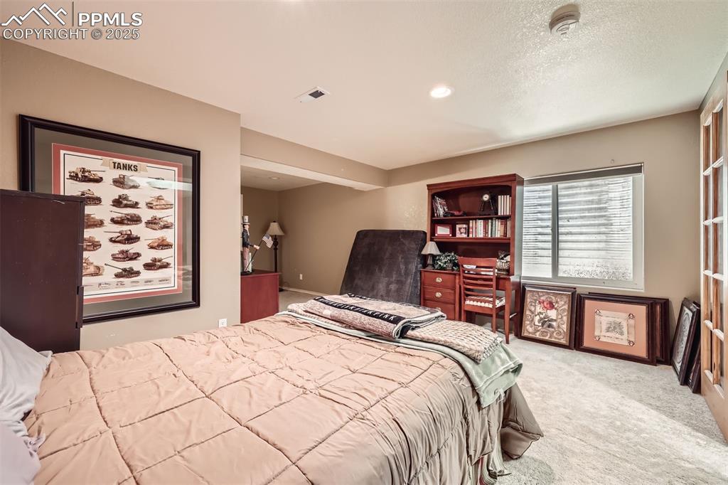 Image 25 of 30: View of carpeted bedroom