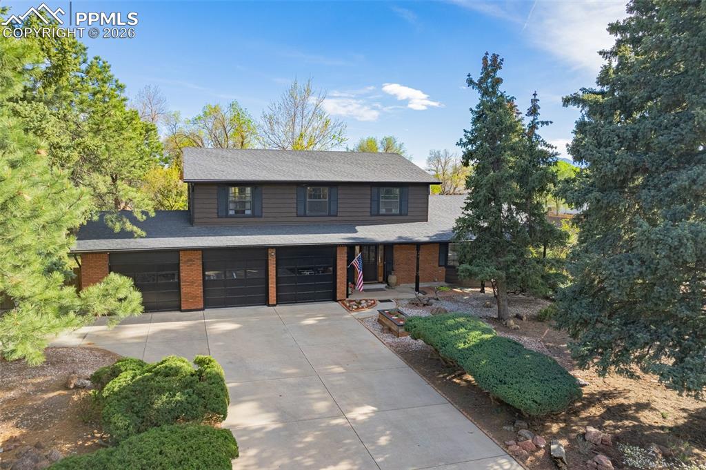 Image 45 of 45: 3 car garage - round through driveway