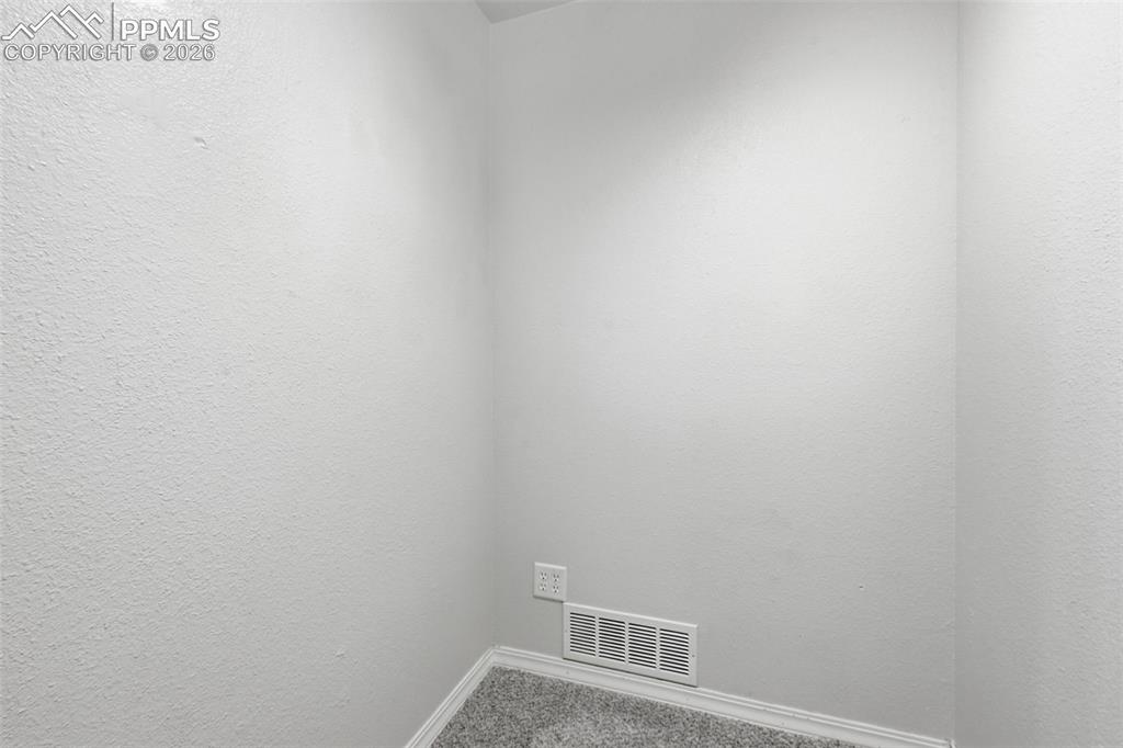 Image 10 of 34: 2 extra storage closets off living room
