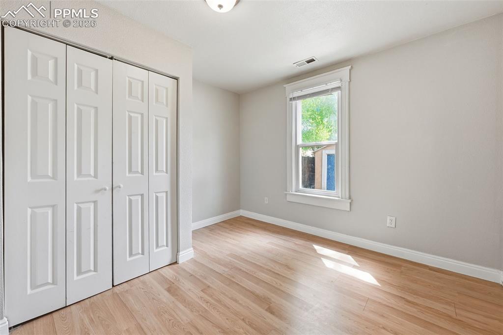 Image 18 of 34: 2nd bedroom on main level