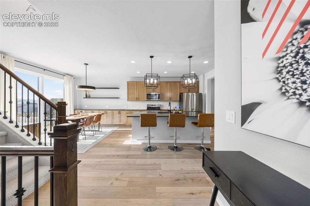 Image 10 of 48: Walking in from the front door takes you to the main floor with the kitchen