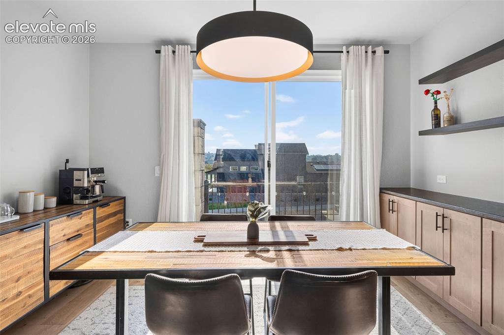 Image 16 of 48: The spacious dining area has plenty of room for all your guests plus a coff