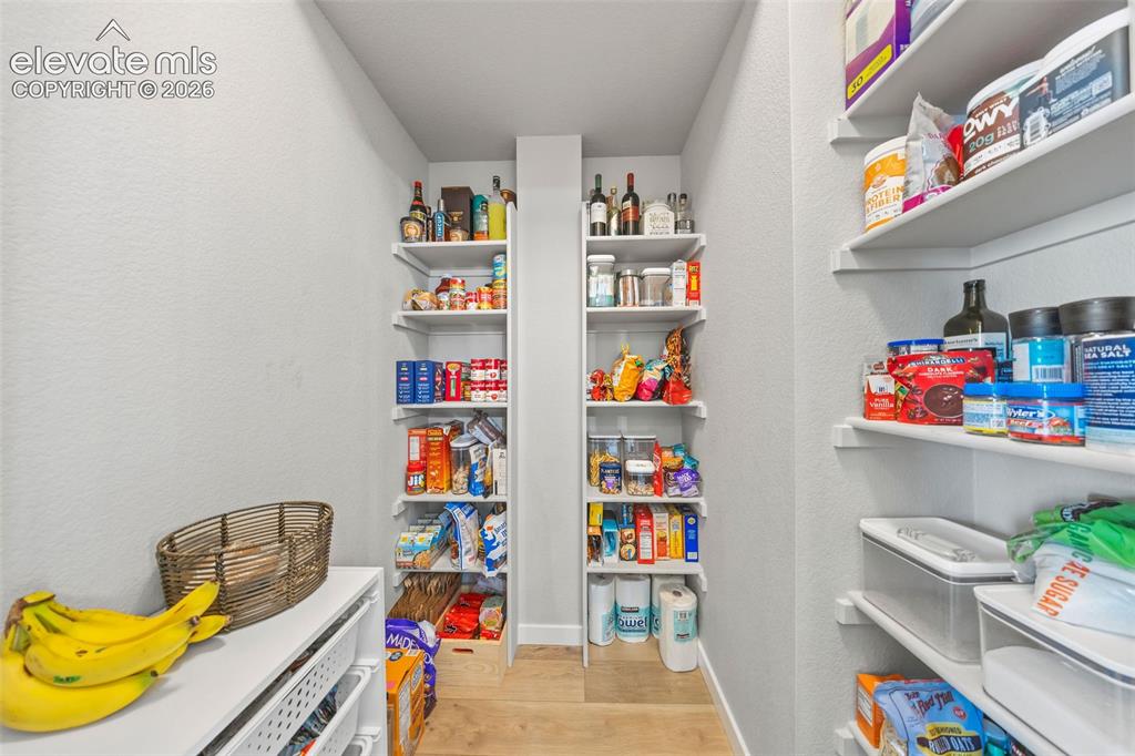 Image 19 of 48: This walk-in pantry offers tons of storage! Costco is nearby and you
