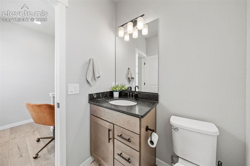 Image 21 of 48: This main-floor powder bath is tucked away from the living areas but perfec