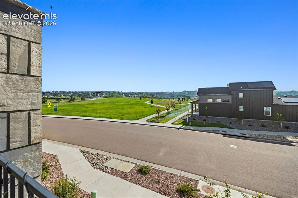 Image 37 of 48: View of the park from the balcony. Look at all that beautiful green space t