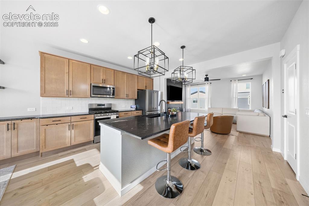 Image 5 of 48: The kitchen is open to the living room for a great flow to this floor plan.