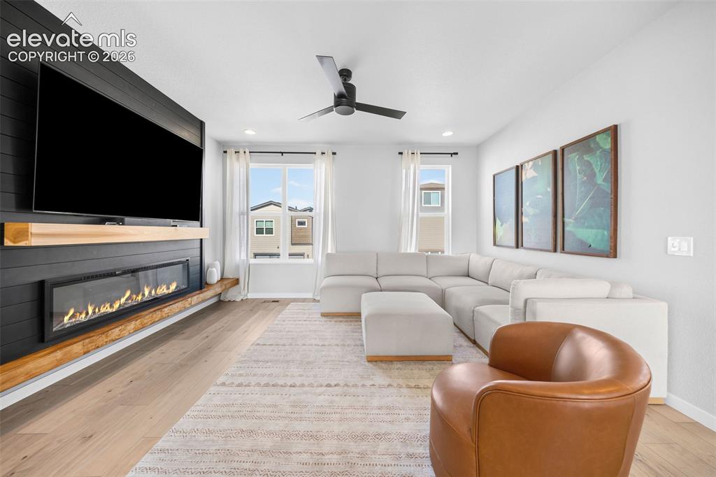 Image 6 of 48: The star of the living room is this gorgeous feature wall with a built-in f