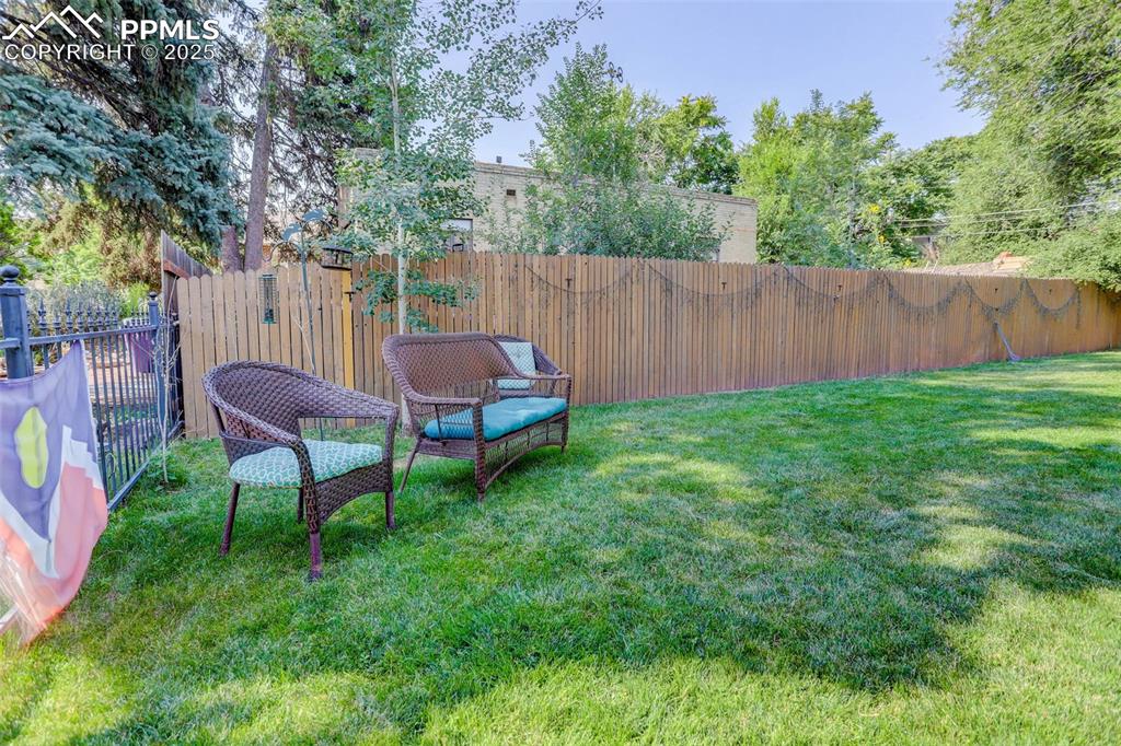 Image 30 of 37: Enjoy reading in the shade of this large yard.