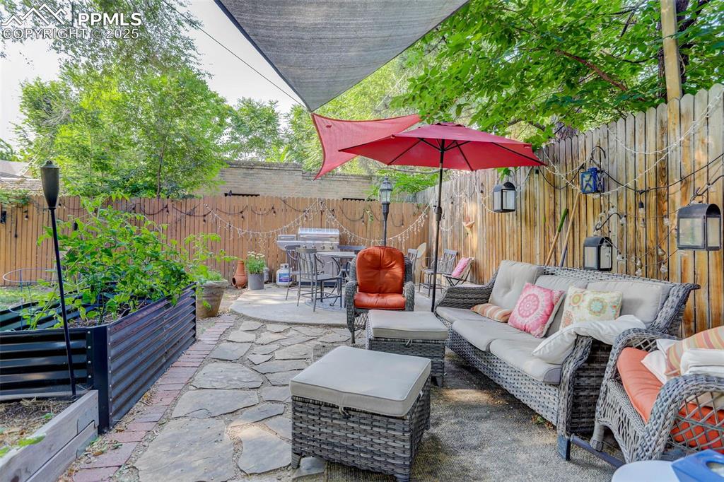 Image 33 of 37: Garden planting spaces and seating in the shade