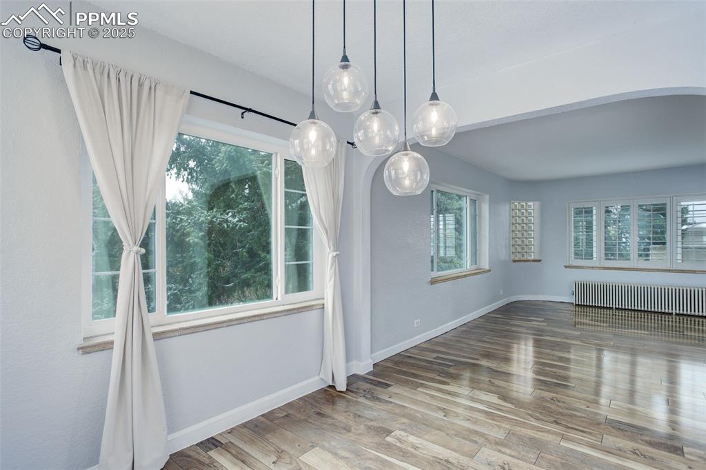 Image 9 of 37: Cozy dining room with updated light fixture